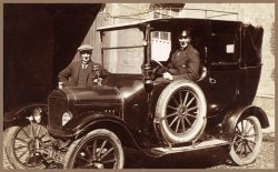 Early 1900's Alexander "Sandy" Greig was owner of a Coach for Hire business in Carnoustie, Scotland. All his coaches were of course horse drawn. In this picture the local automobile dealer was trying unsuccessfully to sell him on changing to the new "horseless carriage"  Sandy did not trust the new phenonemum phenomenon and stayed with his horses.  View full size 